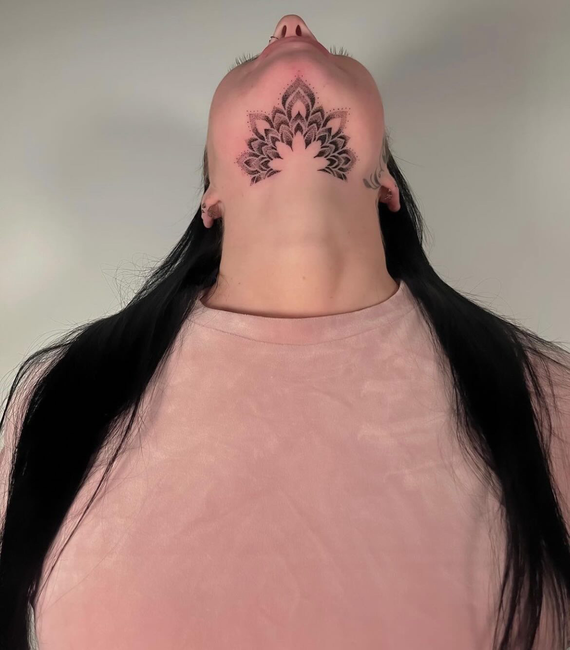 Dot work black and grey chin mandala tattoo created by tattoo artist Alessandra Clivio.